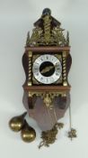 A REPRODUCTION WALL CLOCK IN THE DUTCH STYLE