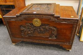 AN ORIENTAL CAMPHORWOOD CHEST having deep carved panels to front, sides and top, featuring sailing