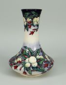 A MOORCROFT POTTERY NARROW NECKED VASE limited edition (7/62) in the 'Snowberry' pattern dated 2002,
