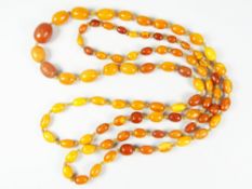 GRADUATED STRING OF AMBER BEADS, 152cms long approx. 70 grams approx.