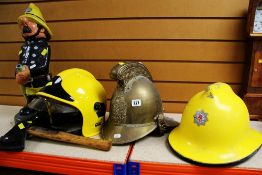 A PARCEL OF FIREFIGHTERS' ITEMS including gilt metal helmet, two modern helmets, garden statue ETC