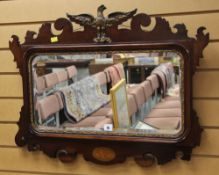 A GOOD ANTIQUE WALL MIRROR having gilded moulded eagle finial and gilded moulded slip with a