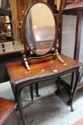 AN ANTIQUE MAHOGANY TABLE and an antique toilet mirror