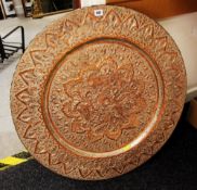 A MIXED METAL PERSIAN PLAQUE profusely decorated in relief, 77cms diam.