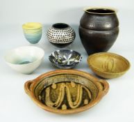 A GROUP OF SEVEN STUDIO POTTERY VESSELS including large flared neck vase 28cms high, potters