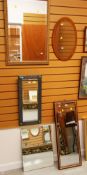 A PEWTER FRAMED BEVELLED WALL MIRROR and four further mirrors