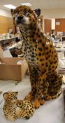 A LARGE POTTERY SEATED CHEETAH and another