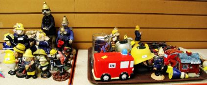 AN ASSORTMENT OF FIREFIGHTER ORNAMENTS INCLUDING Meercats, Beswick figure, novelty teapot and