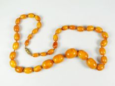 GRADUATED STRING OF AMBER BEADS, 75cms long approx. 73 grams approx.