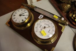 A REPRODUCTION MARITIME STYLE CLOCK AND BAROMETER SET TOGETHER WITH a brass-encased thermometer