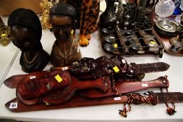 TWO CARVED WOODEN NATIVE BUSTS AND A PARCEL OF EXOTIC WOODEN SOUVENIRS