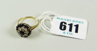 9 CARAT GOLD DIAMOND FLOWER HEAD DRESS RING (ONE STONE MISSING) 3.1 grams approx.