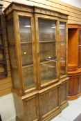 A LATE C20TH BAMBOO EFFECT BOOKCASE CUPBOARD with break-front