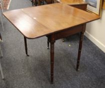 AN ANTIQUE DROP FLAP TABLE having single end-drawer on four turned corner supports with brass