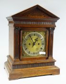 A FUSEE OAK ENCASED GERMAN-TYPE ARCHITECUTURAL MANTEL CLOCK, 41cms high