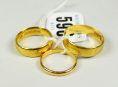 THREE SIMILAR TWENTY TWO CARAT YELLOW GOLD BANDS (one engraved 'Mam') 15.3 grams overall approx.