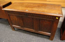 AN EARLY C19TH OAK COFFER CHEST the facade with three fielded panels, having sgraffito and marquetry