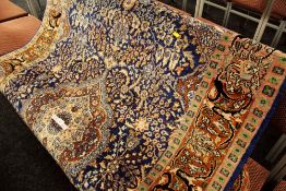 A GOOD PERSIAN CARPET from the Poshtkohi region in rich brown and blue geometric design 244 x