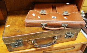A GOOD VINTAGE TAN LEATHER SUITCASE and a later satchel