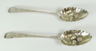 TWO SIMILAR SILVER SCROLL ENGRAVED BERRY SPOONS, having engraved initials, mixed London hallmarks