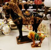A REPRODUCTION POTTERY STANDING HORSE and another
