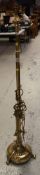A TELESCOPIC ANTIQUE BRASS STANDARD LAMP