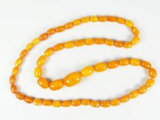 GRADUATED STRING OF AMBER BEADS, 72 cms long approx. 41 grams approx.