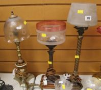 THREE ORNAMENTAL TABLE LAMPS WITH GLASS SHADES