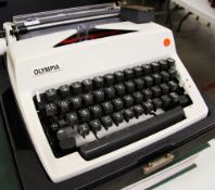 A CASED MID-CENTURY OLYMPIA INTERNATIONAL TYPEWRITER