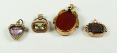 SMALL GROUP OF FOBS AND PENDANTS to include 9 carat gold revolving bloodstone and carnelian fob,