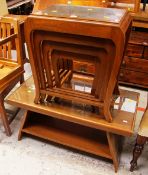 A NEST OF FOUR ORIENTAL CARVED COFFEE TABLES together with a similar Long John coffee table with