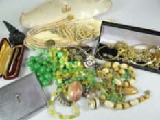 COSTUME JEWELLERY contained within a shoebox and includes yellow metal chains, bracelets, jade ring,