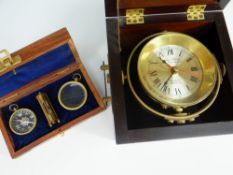 A REPRODUCTION JOHN POOLE SHIP'S CLOCK on a gimbal and in a wooden carry-case together with a