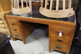 A VINTAGE SIX-DRAWER OFFICE DESK