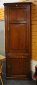 A C19TH WELSH OAK TWO SECTION CORNER BLIND-CUPBOARD having panelled exterior and shaped interior