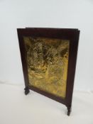 LATE 20TH CENTURY BRASS ARTS & CRAFTS PANEL with repousse decoration of circular scene with