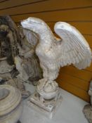 VICTORIAN PLASTER MAQUETTE OF AN EAGLE perched upon an orb over a stepped square base, 72cms high