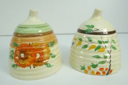TWO CLARICE CLIFF BEEHIVE SHAPED HONEY POTS WITH LIDS