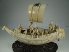 JAPANESE MEIJI PERIOD SECTIONAL IVORY MODEL OF A SHIP, the scene including figures, large fishing
