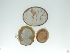 THREE ANTIQUE CAMEO BROOCHES to include an extensively carved mythological scene oval brooch with