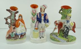 THREE NINETEENTH CENTURY STAFFORDSHIRE POTTERY SPILL HOLDERS comprising Little Red Riding Hood,