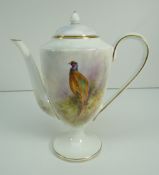 ROYAL WORCESTER PORCELAIN COFFEE POT decorated with a pheasant in foliage on a forest floor to a