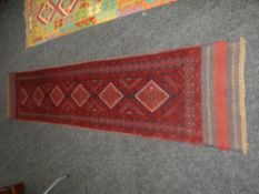 MESHWANI RUNNER in red and blue ground geometric pattern, 277 x 62cms