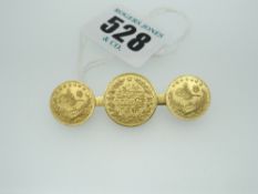 THREE TURKISH BELIEVED GOLD COINS on an 18ct yellow gold bar brooch, 10.2gms total