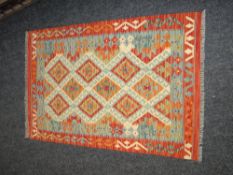 VEGETABLE DYED WOOL CHOBI KELIM RUNNER in rust and orange ground geometric pattern, 150 x 102cms