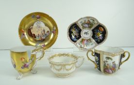 TWO AUSTRIAN PORCELAIN CUPS AND SAUCERS together with an early Derby porcelain cup, the Austrian