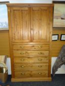 TURN-OF-THE-CENTURY PINE PANELLED KITCHEN BLIND CUPBOARD comprising base of five graduated