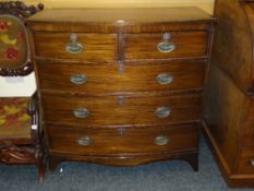 CROSS-BANDED MAHOGANY BOW-FRONT CHEST of three long and two short drawers and with brass handles and