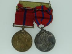 PAIR OF METROPOLITAN POLICE MEDALS with ribbons on a bar for Coronation of His Majesty King Edward