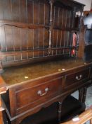 VINTAGE KITCHEN DRESSER having a cavity base, two drawers and two-tier open shelved rack, 122cms